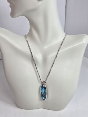 MIKA Silver tone Necklace with Blue Crystal long oval Pendant icy sea blue 20in